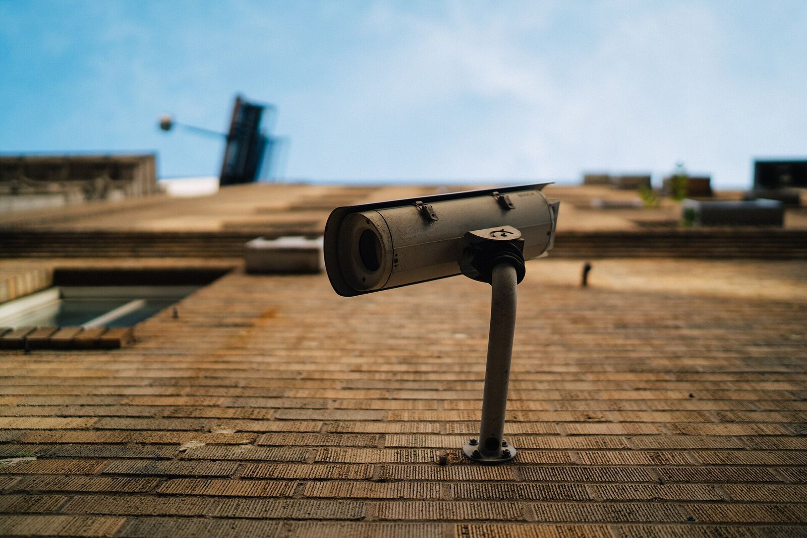 Outdoor surveillance camera on a building facade